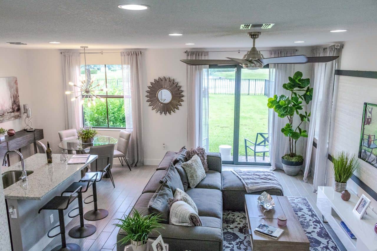 Home Stylish contemporary living room with open kitchen layout and natural light.